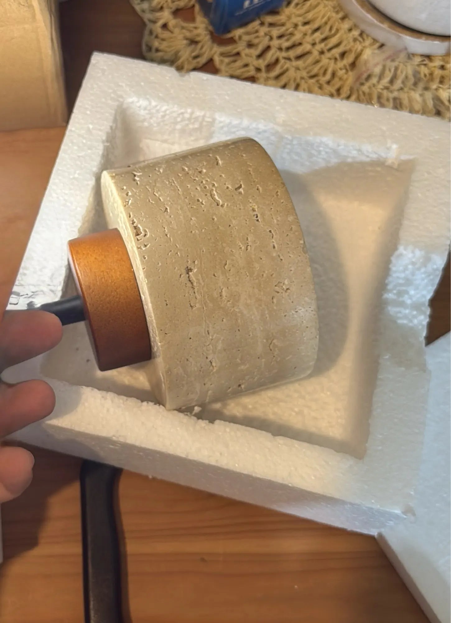 Travertine pendant lit, showing the stone grain glowing