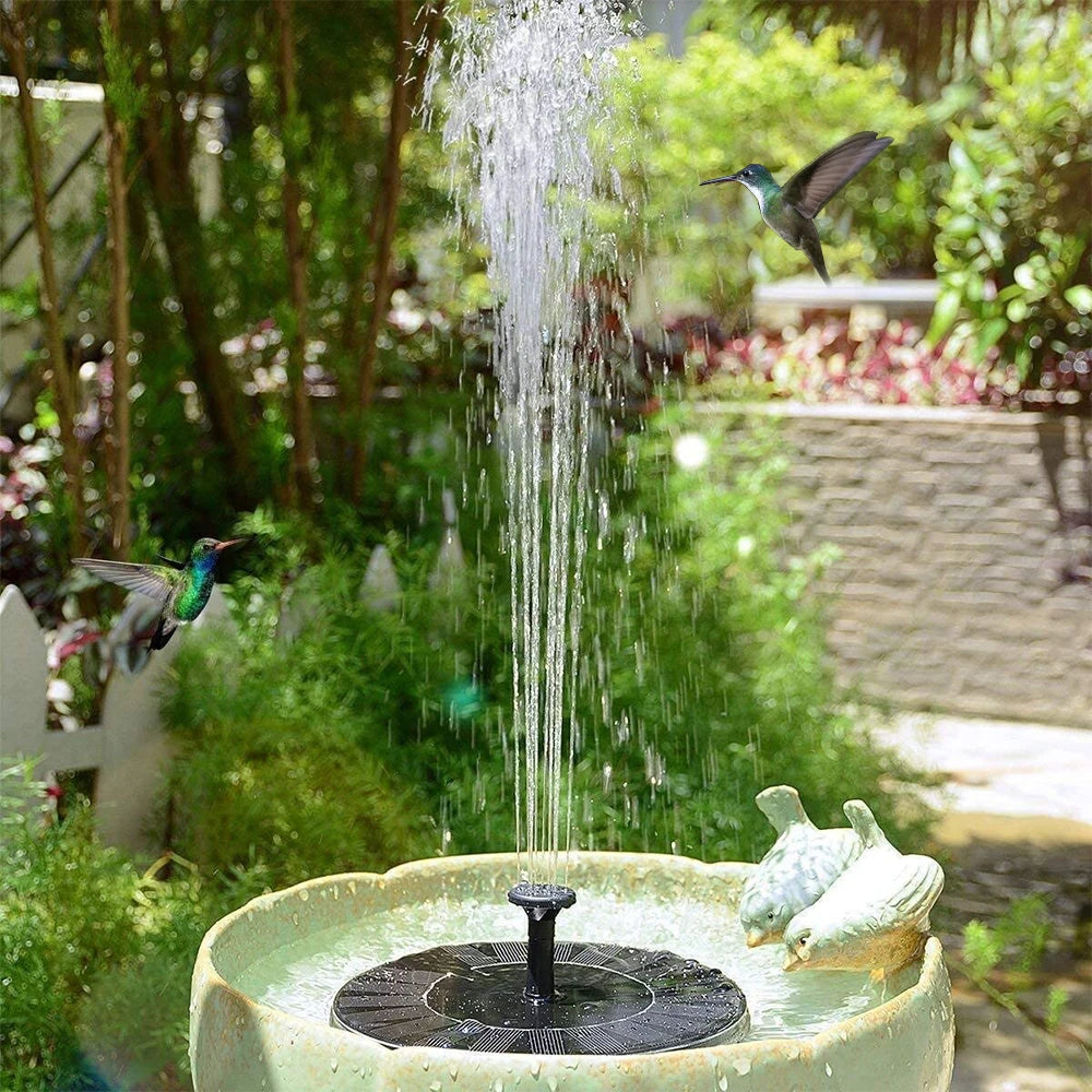 Solar fountain running in a garden birdbath