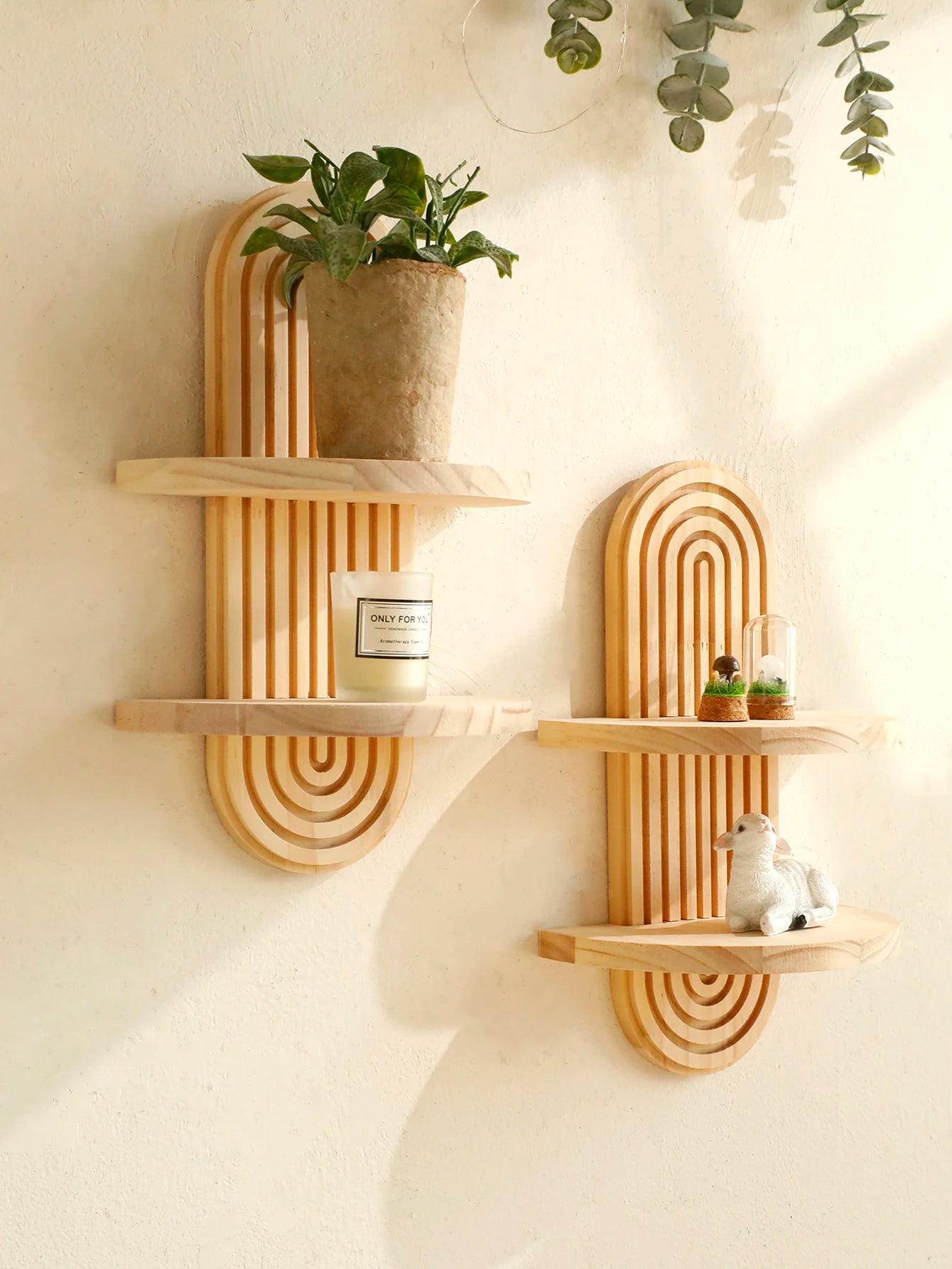 Two arched shelves hung at different heights