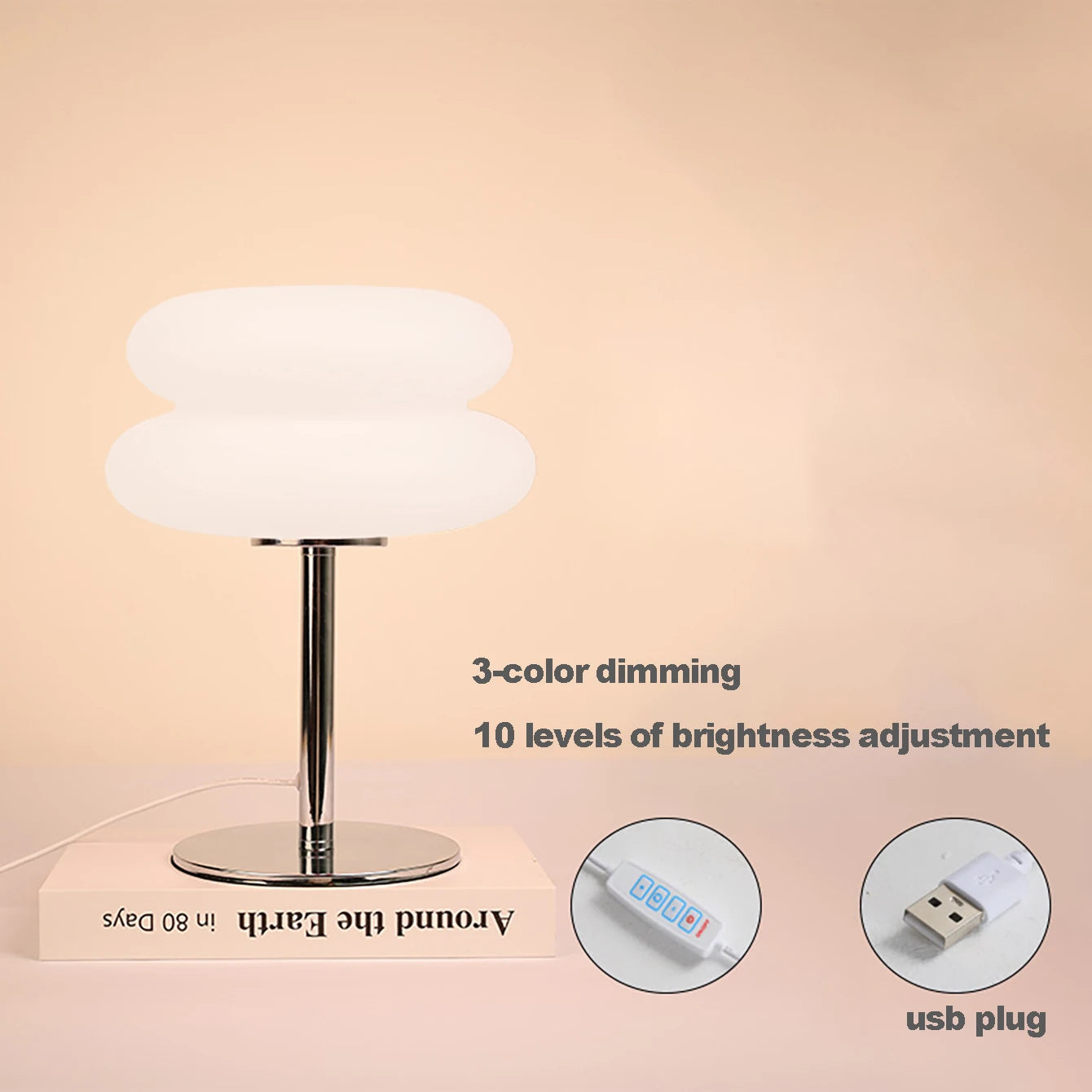 Amber version of the cream style lamp lit on a table