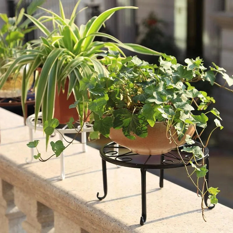 Plant stand holding a pot on a patio
