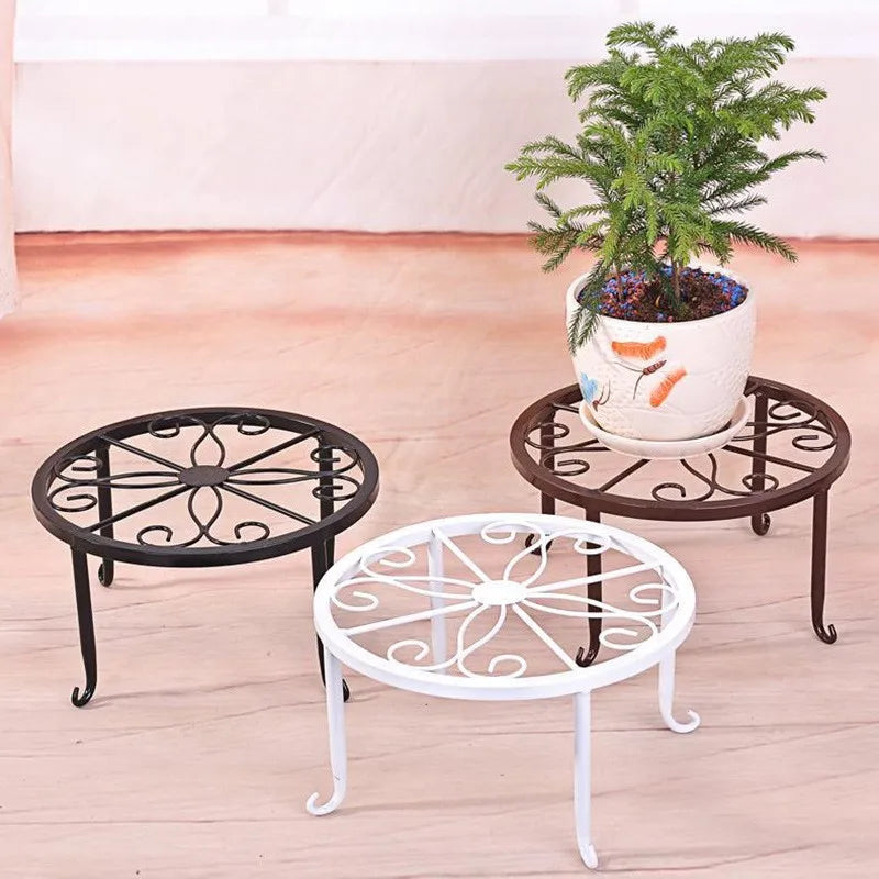 Iron plant stands in black, brown and white with a potted plant