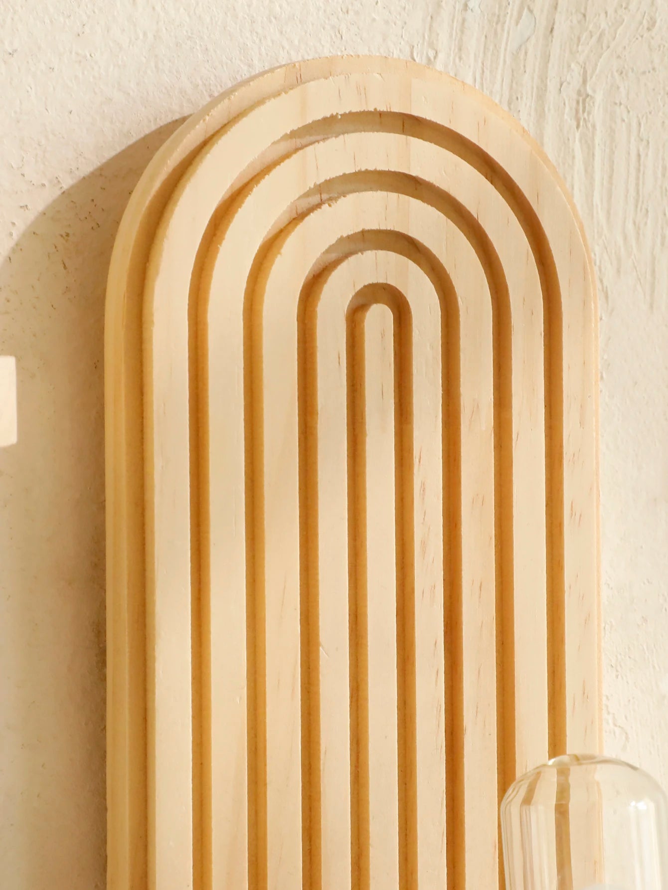 Wall shelf styled with a candle and ceramics