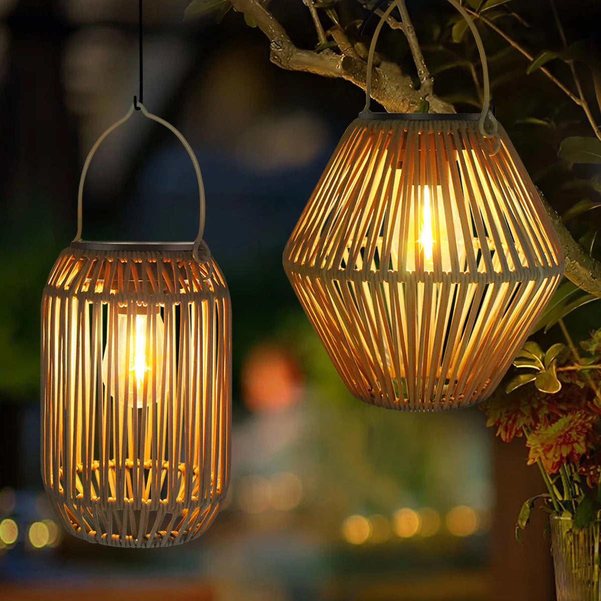 Two woven solar lanterns glowing in a tree at dusk