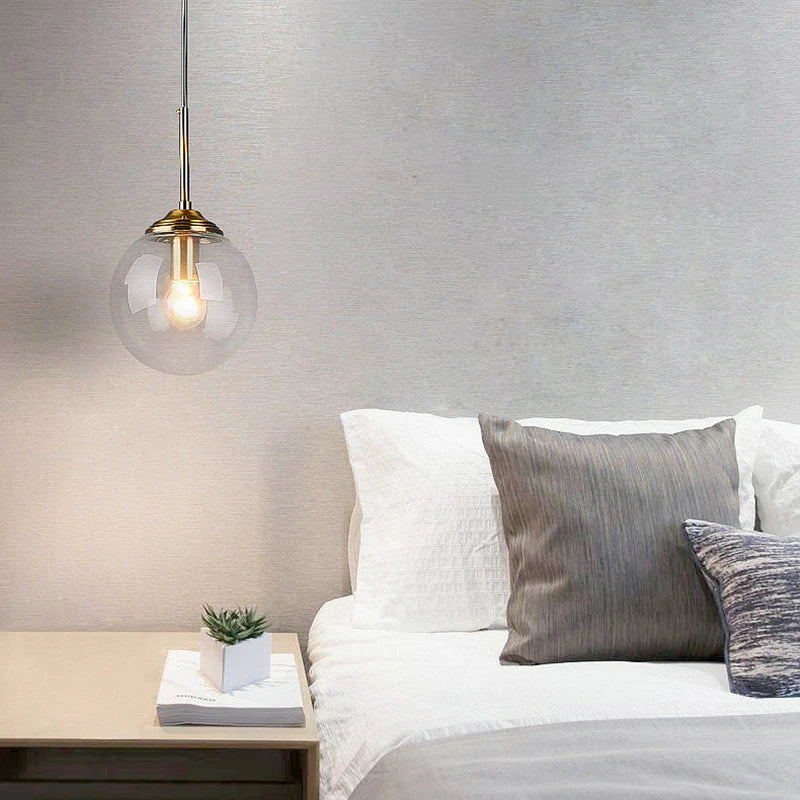 Smoke grey pendant against a dark wall
