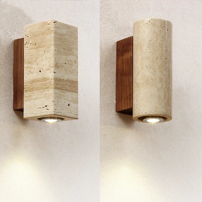 Square travertine sconce on a wood base, lit