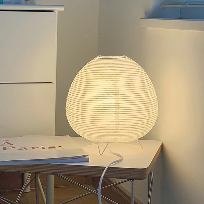 Ribbed globe shade lit, showing the diffused warm light
